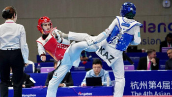 Фотография к новости: Парижде атой саламыз – пара таеквондошылар