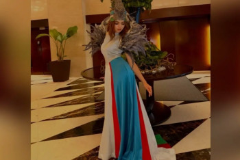 Фотография к новости: Өзбекстанның ұлттық туының түстеріндегі көйлек үшін модельге айыппұл салынды